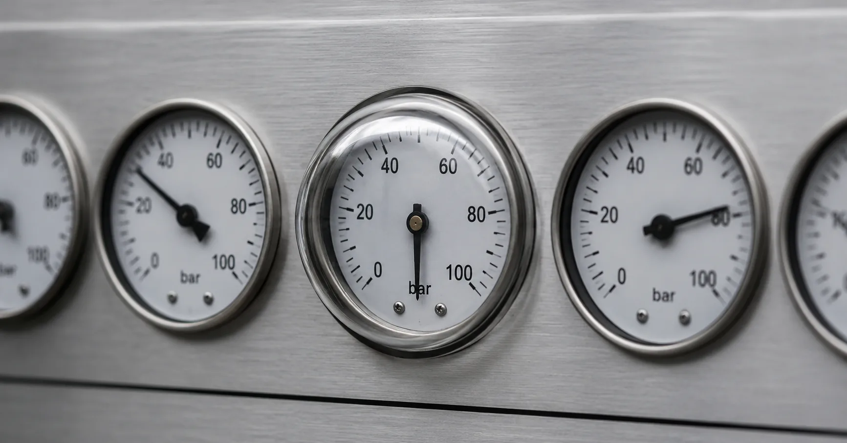 A row of dials where every needle has moved except one frozen under glass, showing an AI prompt left unchanged while conditions shift